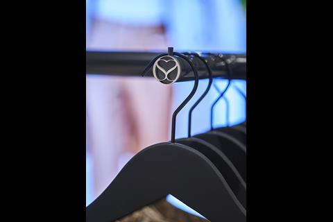 Close-up on hangers on rail at Interior of Sosandar Chelmsford store